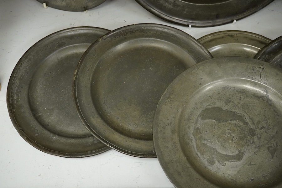 A collection of 18th and 19th century pewter plates, largest 34.5cm diameter (9). Condition - good considering age and use